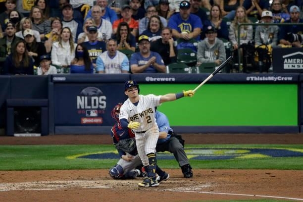Luis Urias of the Milwaukee Brewers hits a single in the ninth during game 2 of the National League Division Series against the Atlanta Braves at...