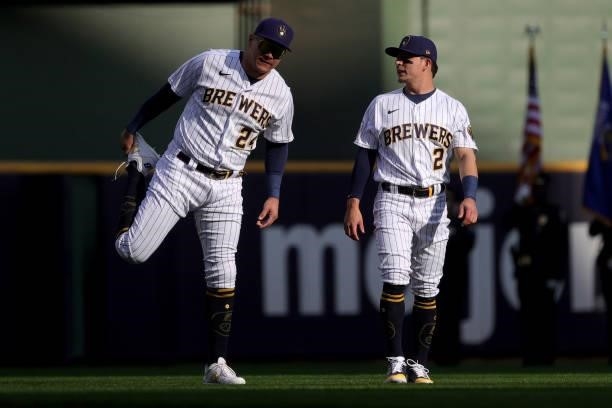 Avisail Garcia and Luis Urias of the Milwaukee Brewers warm up prior to game 2 of the National League Division Series against the Atlanta Braves at...