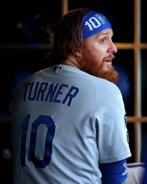 Justin Turner of the Los Angeles Dodgers looks on from the dugout before Game 2 of the National League Division Series against the San Francisco...