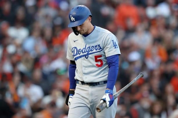 Corey Seager of the Los Angeles Dodgers walks back to the dugout after striking out in the first inning against the San Francisco Giants during Game...