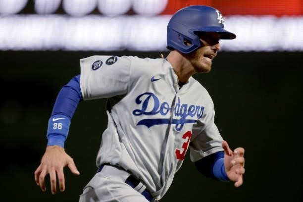 Cody Bellinger of the Los Angeles Dodgers runs to home plate to score a run in the sixth inning against the San Francisco Giants during Game 2 of the...