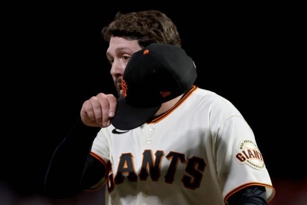 Dominic Leone of the San Francisco Giants walks off the field in the sixth inning against the Los Angeles Dodgers during Game 2 of the National...