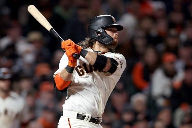 Brandon Crawford of the San Francisco Giants hits an RBI single in the sixth inning against the Los Angeles Dodgers during Game 2 of the National...