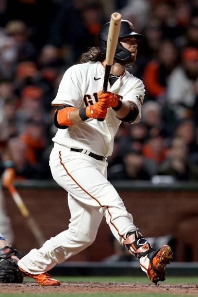 Brandon Crawford of the San Francisco Giants hits an RBI single in the sixth inning against the Los Angeles Dodgers during Game 2 of the National...