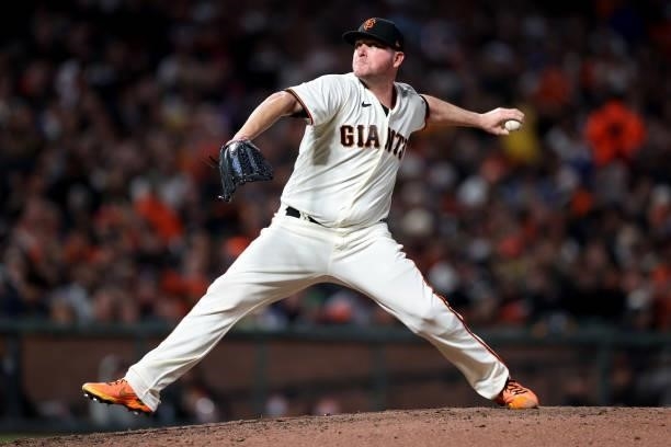 Jake McGee of the San Francisco Giants pitches in the seventh inning against the Los Angeles Dodgers during Game 2 of the National League Division...