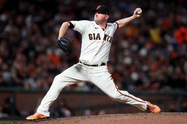 Jake McGee of the San Francisco Giants pitches in the seventh inning against the Los Angeles Dodgers during Game 2 of the National League Division...