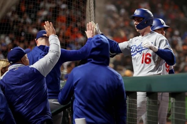 Will Smith of the Los Angeles Dodgers celebrates with teammates after hitting a home run in the eighth inning against the San Francisco Giants during...