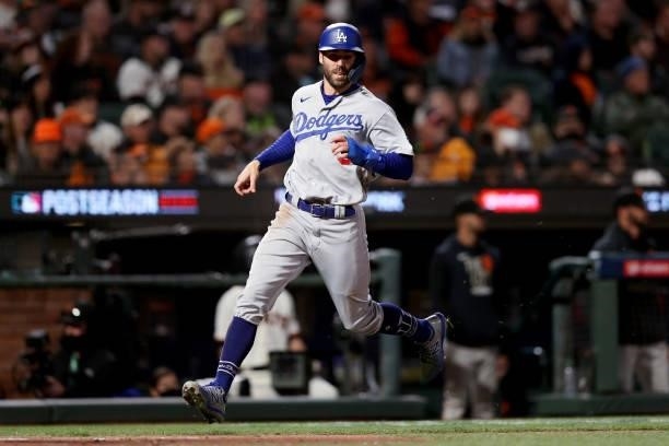 Chris Taylor of the Los Angeles Dodgers runs to home plate to score a run in the eighth inning against the San Francisco Giants during Game 2 of the...