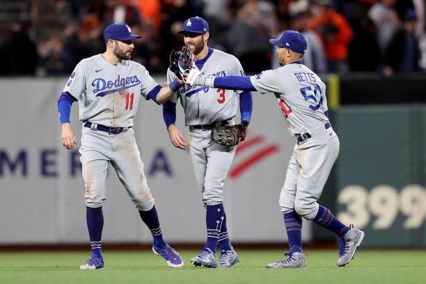 Pollock, Chris Taylor, and Mookie Betts of the Los Angeles Dodgers celebrate after beating the San Francisco Giants 9-2 in Game 2 of the National...