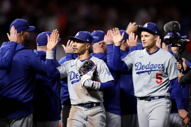 Mookie Betts of the Los Angeles Dodgers celebrates with teammates after beating the San Francisco Giants 9-2 in Game 2 of the National League...