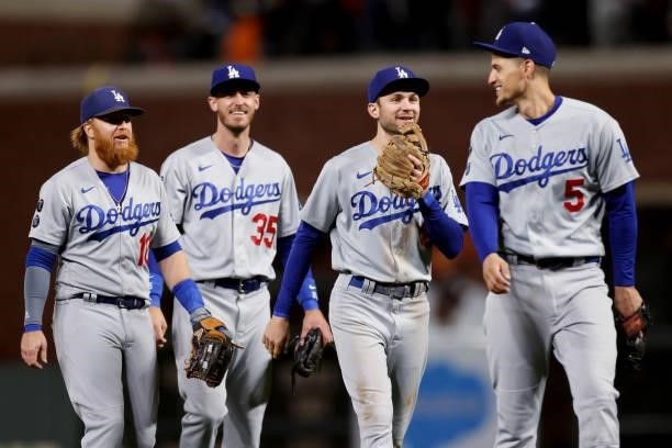 Justin Turner, Cody Bellinger, Trea Turner, and Corey Seager of the Los Angeles Dodgers celebrate after beating the San Francisco Giants in Game 2 of...