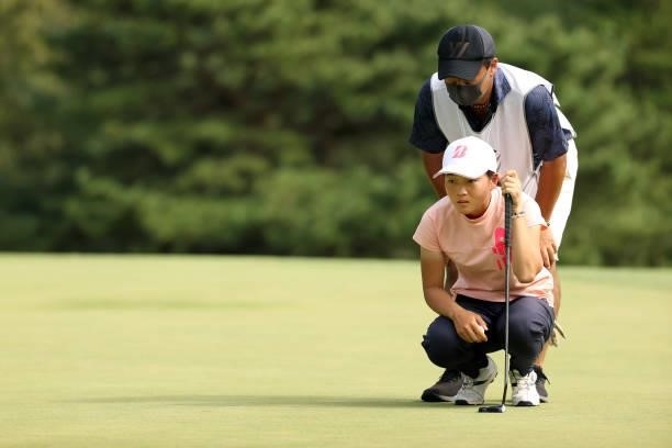 Amateur Miyu Sato of Japan lines up a putt on the 11th green during the final round of the Stanley Ladies at Tomei Country Club on October 10, 2021...