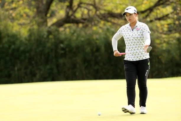 Mao Saigo of Japan lines up a putt on the 13th green during the final round of the Stanley Ladies at Tomei Country Club on October 10, 2021 in...