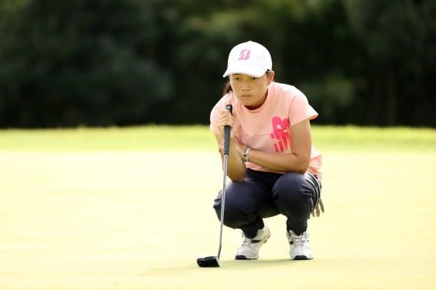 Amateur Miyu Sato of Japan lines up a putt on the 16th green during the final round of the Stanley Ladies at Tomei Country Club on October 10, 2021...