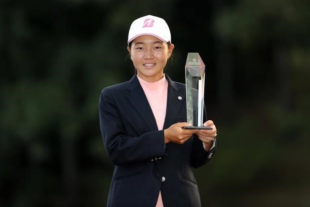 Low amateur Miyu Sato of Japan poses with the trophy after the final round of the Stanley Ladies at Tomei Country Club on October 10, 2021 in Susono,...