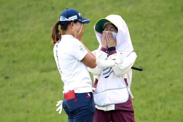 Hinako Shibuno of Japan sheds tears with joy with her caddie after winning the tournament through the playoff following the final round of the...