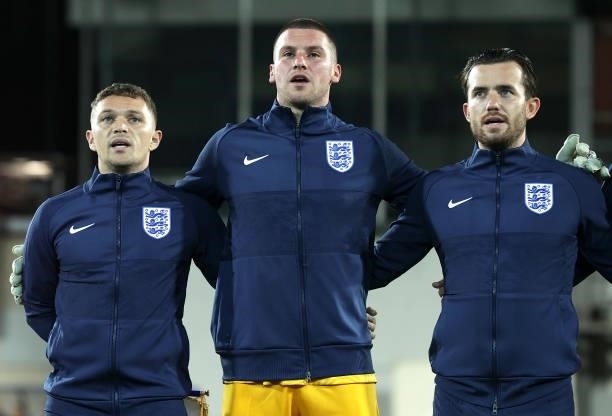 Kieran Trippier, Sam Johnstone and Ben Chilwell sing the national anthem prior to the 2022 FIFA World Cup Qualifier match between Andorra and England...