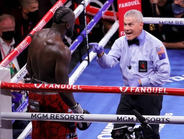 Referee Russell Mora talks with Deontay Wilder in the 10th round of his WBC heavyweight title fight against Tyson Fury at T-Mobile Arena on October...