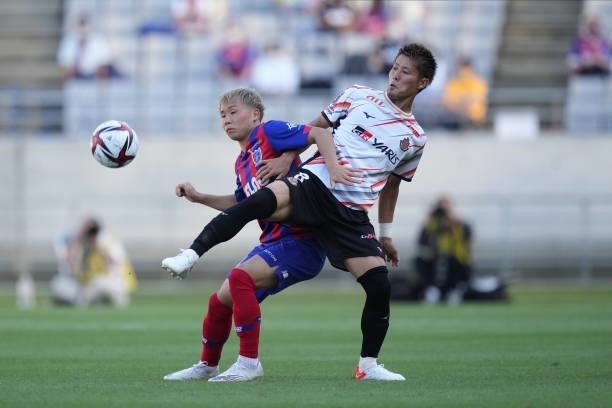 Shuto ABE of FC Tokyo and Yoichiro KAKITANI of Nagoya Grampus battle for the ball during the J.League Levain Cup Semi Final second leg match between...