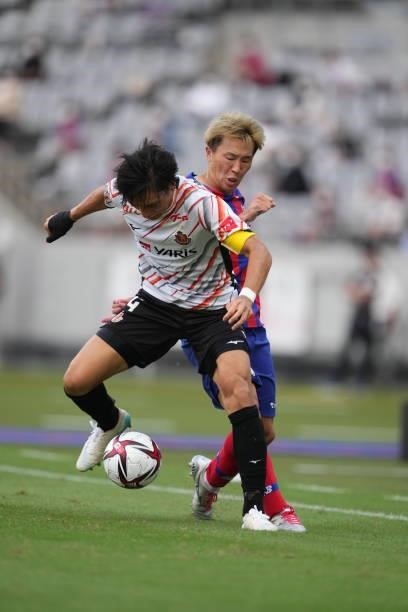 Kensuke NAGAI of FC Tokyo and NG0 battle for the ball during the J.League Levain Cup Semi Final second leg match between FC Tokyo and Nagoya Grampus...