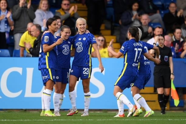 Fran Kirby of Chelsea celebrates with teammates Sam Kerr and Pernille Harder after scoring their side's second goal during the Barclays FA Women's...