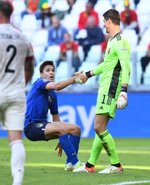 Federico Chiesa of Italy competes for the ball with Thibaut Courtois of Belgium during the UEFA Nations League 2021 Third Place Match between Italy...