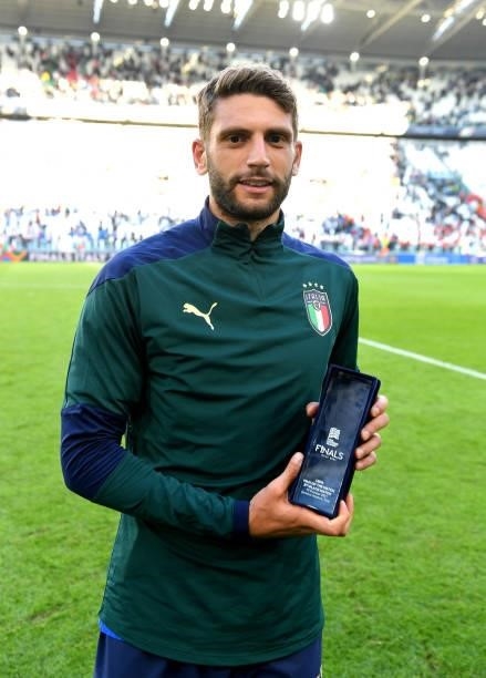 Domenico Berardi of Italy poses for a photo with the Player of the match award following victory in the UEFA Nations League 2021 Third Place Match...