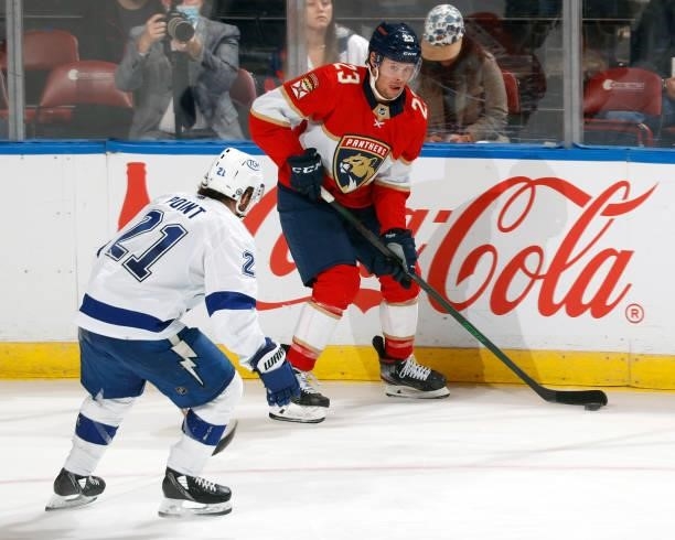 Brayden Point of the Tampa Bay Lightning defends against Carter Verhaeghe of the Florida Panthers during an NFL preseason game at the FLA Live Arena...