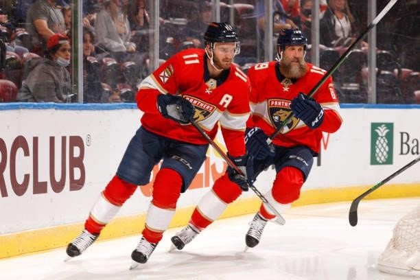 Jonathan Huberdeau and Joe Thornton of the Florida Panthers circles behind the Tampa Bay Lightning net during a preseason game at the FLA Live Arena...