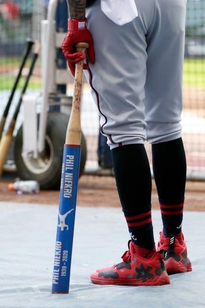 Picture of a warm up bat used during batting practice displaying a Phil Niekro logo by a Atlanta Braves player before game 2 of the National League...