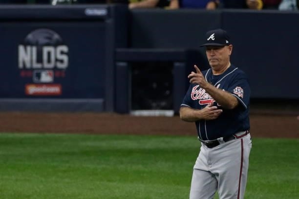 Atlanta Braves manager Brian Snitker makes a pitching change during game 2 of the National League Division Series at American Family Field on October...