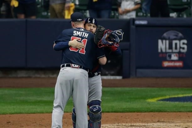Will Smith of the Atlanta Braves celebrates with Travis d'Arnaud of the Atlanta Braves after the final out of the game 2 of the National League...