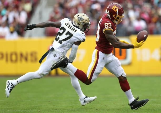 Ricky Seals-Jones of the Washington Football Team catches the ball as Malcolm Jenkins of the New Orleans Saints defends during the first half at...