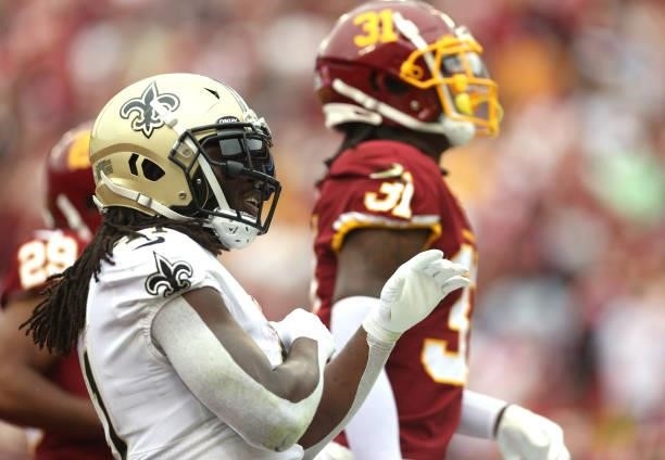 Alvin Kamara of the New Orleans Saints celebrates during the first half against the Washington Football Team at FedExField on October 10, 2021 in...