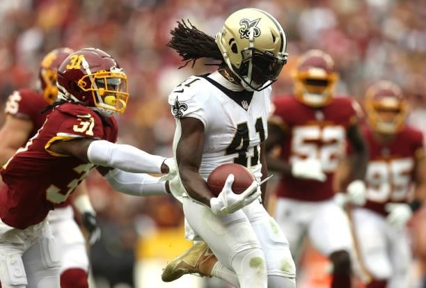 Alvin Kamara of the New Orleans Saints rushes for a touchdown during the first half against the Washington Football Team at FedExField on October 10,...