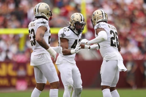 Marcus Williams of the New Orleans Saint, P.J. Williams and Marshon Lattimore react during the first half against the Washington Football Team at...