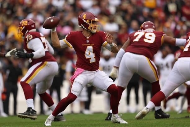 Taylor Heinicke of the Washington Football Team throws the ball during the first half against the New Orleans Saints at FedExField on October 10,...