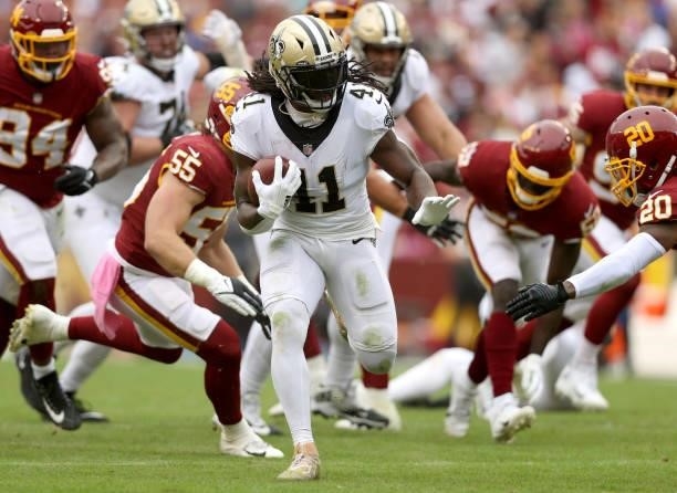 Alvin Kamara of the New Orleans Saints rushes for a touchdown during the first half against the Washington Football Team at FedExField on October 10,...