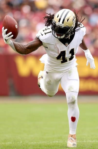 Alvin Kamara of the New Orleans Saints attempts to catch the ball during the second half against the Washington Football Team at FedExField on...