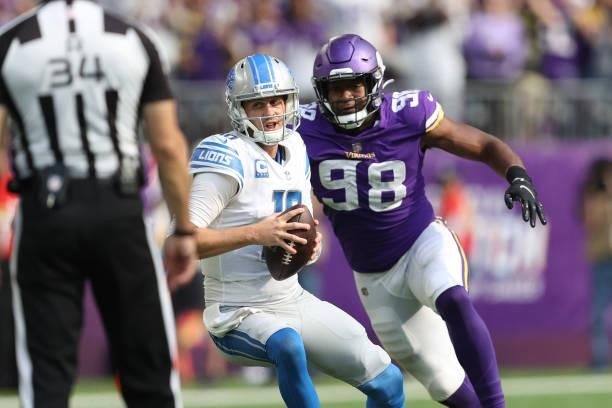 Jared Goff of the Detroit Lions scrambles and is sacked by D.J. Wonnum of the Minnesota Vikings during the fourth quarter at U.S. Bank Stadium on...