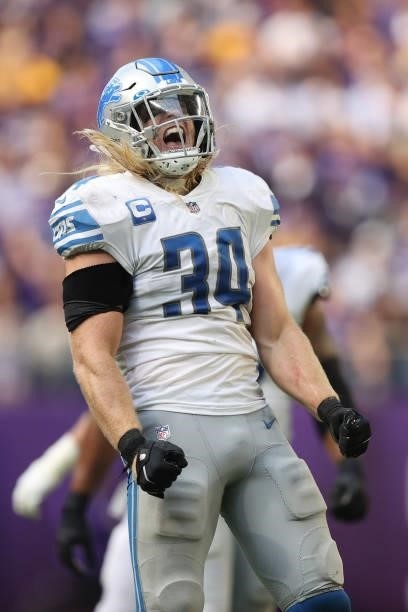 Alex Anzalone of the Detroit Lions celebrates after a defensive stop during the fourth quarter against the Minnesota Vikings at U.S. Bank Stadium on...