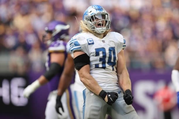 Alex Anzalone of the Detroit Lions celebrates after a defensive stop during the fourth quarter against the Minnesota Vikings at U.S. Bank Stadium on...