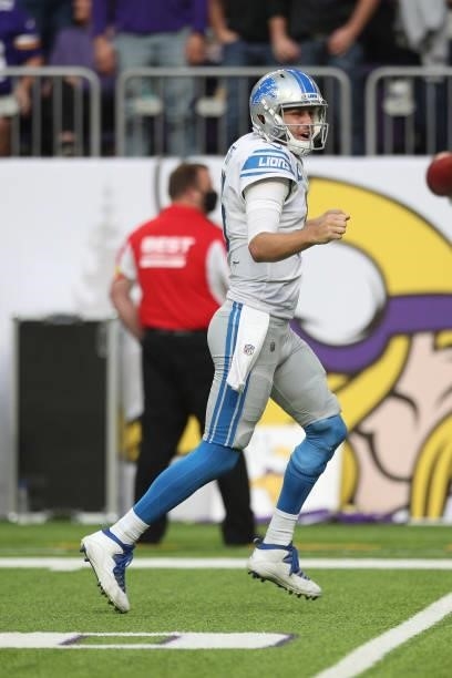 Jared Goff of the Detroit Lions celebrates after a two point conversion during the second half against the Minnesota Vikings at U.S. Bank Stadium on...