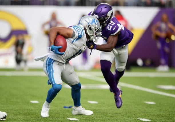 Kalif Raymond of the Detroit Lions avoids a tackle by Kris Boyd of the Minnesota Vikings during the third quarter at U.S. Bank Stadium on October 10,...