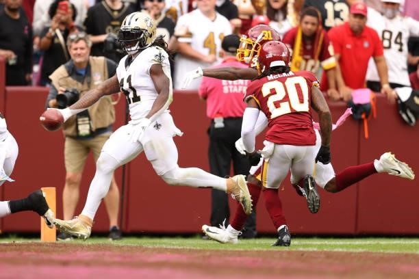 Alvin Kamara of the New Orleans Saints scores a touchdown during the second half against the Washington Football Team at FedExField on October 10,...