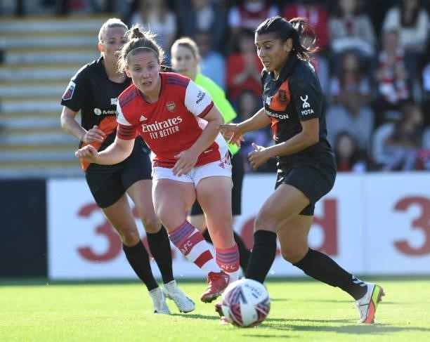 Kim Little of Arsenal passes the ball under pressure from Kenza Dali of Everton during the Barclays FA Women's Super League match between Arsenal...