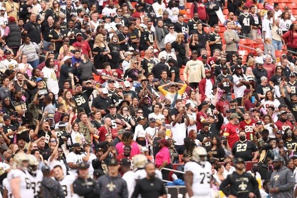 New Orleans Saints fans react after a game against the Washington Football Team at FedExField on October 10, 2021 in Landover, Maryland.