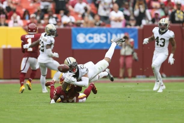 Marshon Lattimore of the New Orleans Saints breaks up a pass intended for Terry McLaurin of the Washington Football Team during the second half at...