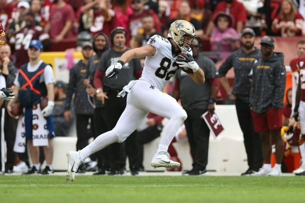 Adam Trautman of the New Orleans Saints runs with the ball during the second half against the Washington Football Team at FedExField on October 10,...