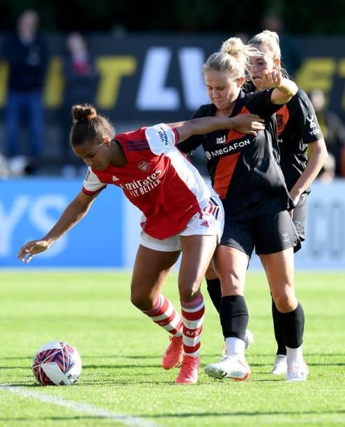 Nikita Parris of Arsenal is challenged by Izzy Christiansen of Everton during the Barclays FA Women's Super League match between Arsenal Women and...